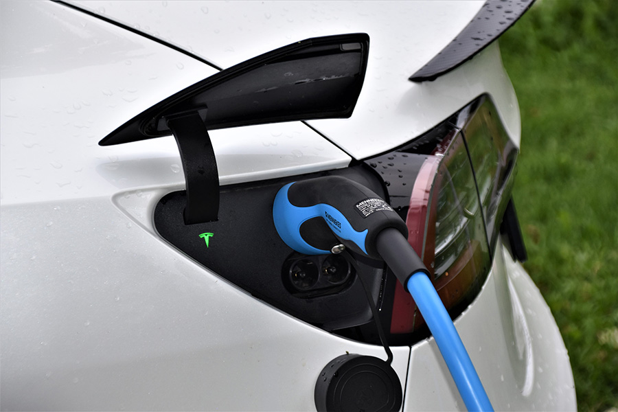 ev_3 A car plugged into an EV charging station.